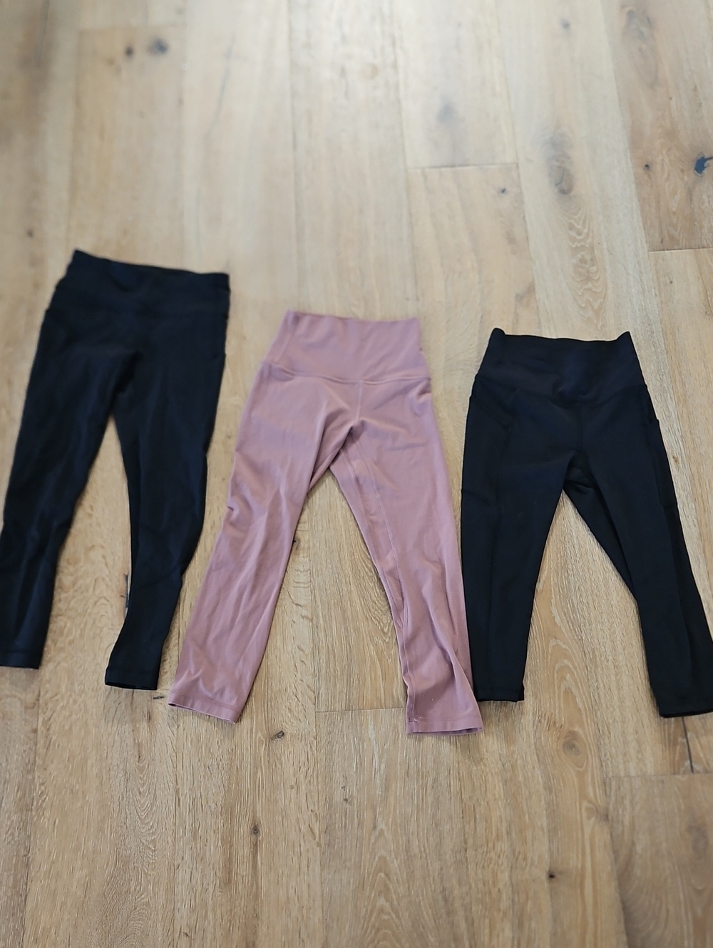 THREE PAIRS of Lululemon Size 2 Crop Leggings